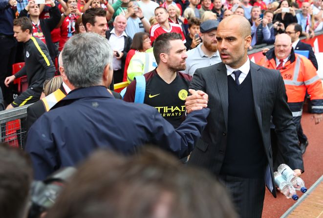  Manchester United manager Jose Mourinho shakes hands with  Manchester City manager Pep Guardiola prior to the Premier League match between Manchester United and Manchester City at Old Trafford on September 10, 2016 in Manchester, England.  