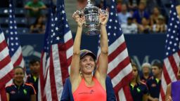 Angelique Kerber of Germany holds up her winning trophy after defeating Karolina Pliskova of Czech Republic in their 2016 US Open Womens Singles final match at the USTA Billie Jean King National Tennis Center in New York on September 10, 2016.
New world number one Angelique Kerber won the US Open title on Saturday with a battling 6-3, 4-6, 6-4 victory over Karolina Pliskova of the Czech Republic. / AFP / Timothy A. CLARY        (Photo credit should read TIMOTHY A. CLARY/AFP/Getty Images)
