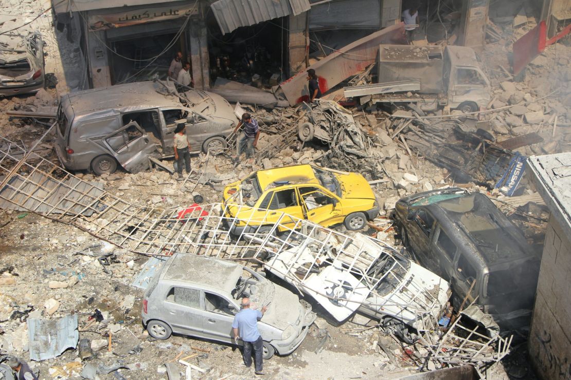 People search for victims at the scene of the airstrikes.