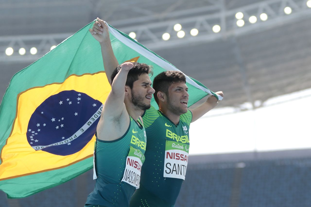Yohansson Nascimento (L) celebrates his bronze medal with gold medalist Petrucio Ferreira dos Santos after the T47 100m final meter. They were just two of four sprint medalists the host nation got to celebrate Sunday.