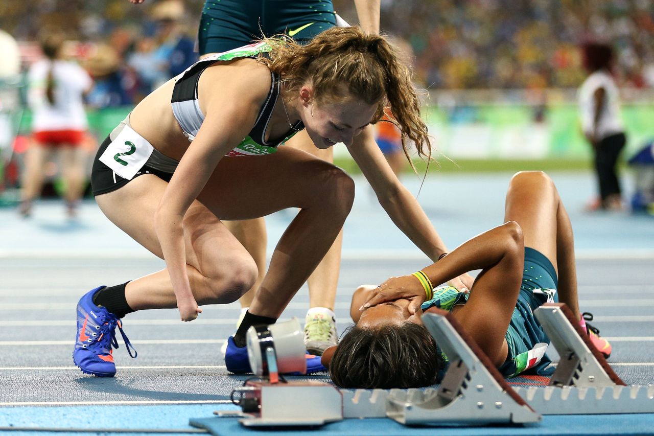 Teresinha de Jesus Correia Santos lies on the floor in tears after surprising the field to win and bronze medal, Brazil's fourth of the day.