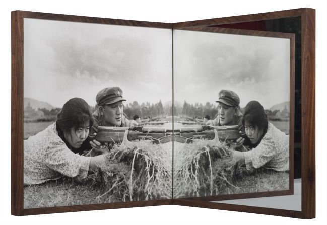Cai Dongdong's installation "Target Practice" uses a mirror to transform one of the artist's old photographs, changing its original meaning and turning the print into a site of play. "At the moment I am most concerned about the relationship between images and a society, and how I can use art to express such relationship," Cai Dongdong tells CNN.