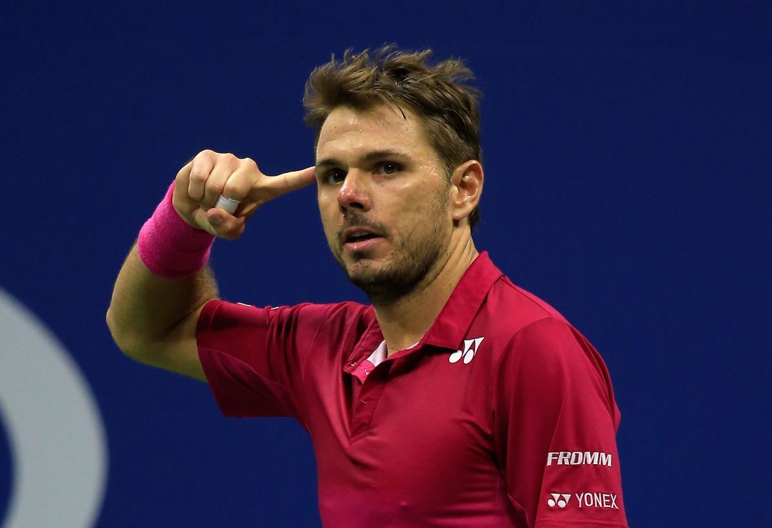Stan Wawrinka points to his temple on the way to victory over Novak Djokovic  in the men's finals of  the 2016 US Open in New York. 