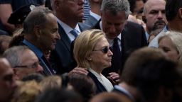 TOPSHOT - New York City Mayor Bill de Blasio speaks to US Democratic presidential nominee Hillary Clinton during a memorial service at the National 9/11 Memorial September 11, 2016 in New York.
The United States on Sunday commemorated the 15th anniversary of the 9/11 attacks. / AFP / Brendan Smialowski        (Photo credit should read BRENDAN SMIALOWSKI/AFP/Getty Images)