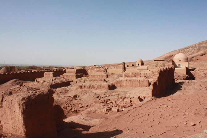 An old Uyghur village made of the flaming red mud and sand of the Taklamakan Desert.