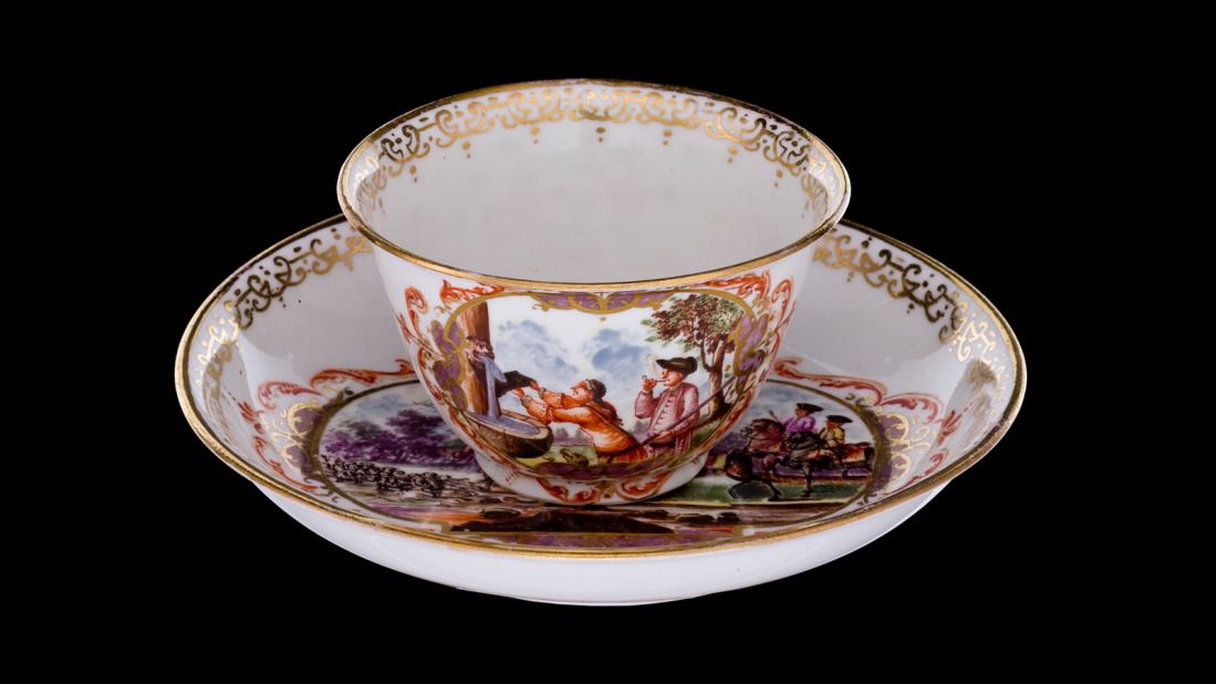 This cup and saucer are decorated with hunting scenes. 