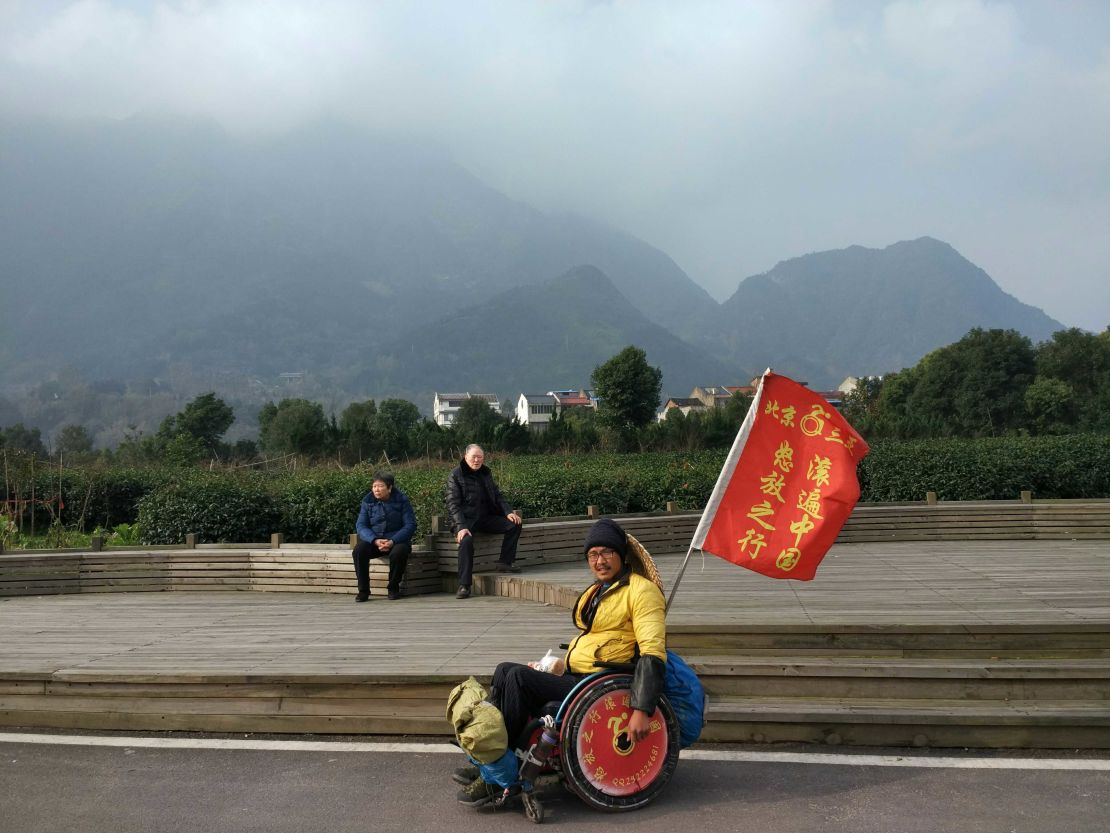 Quan Peng has been travelling across China for the past two years by wheelchair. 