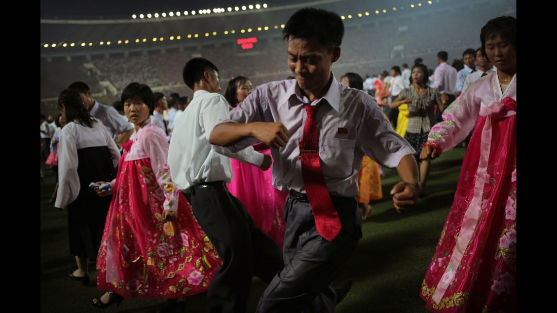 Kids participate in a mass dance party at Kim Il Sung Stadium during celebrations marking the 60th anniversary of the Korean War armistice.