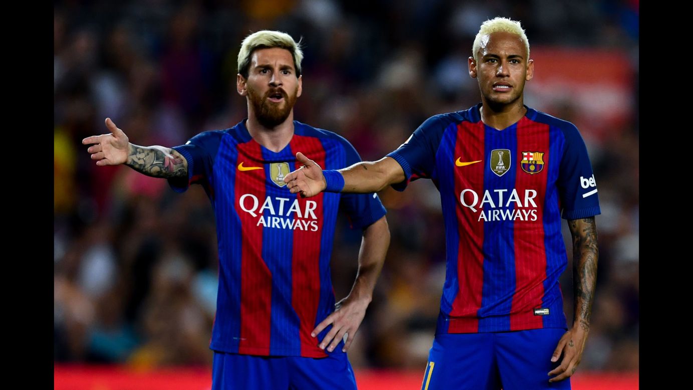 Soccer stars Lionel Messi, left, and Neymar of Barcelona gesture during a match against Deportivo Alaves in Barcelona, Spain, on Saturday, September 10. Deportivo Alaves won 2-1.