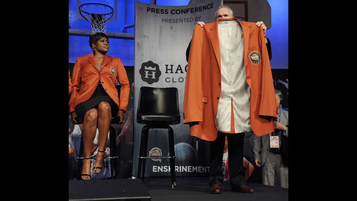 Naismith Memorial Basketball Hall of Fame President and CEO John Doleva holds up the jacket for class of 2016 inductee Yao Ming as Sheryl Swoopes looks on during a news conference in Springfield, Massachusetts, on Thursday, September 8. Allen Iverson, Shaquille O'Neal, Tom Izzo and Jerry Reinsdorf  were also elected to the Hall of Fame.