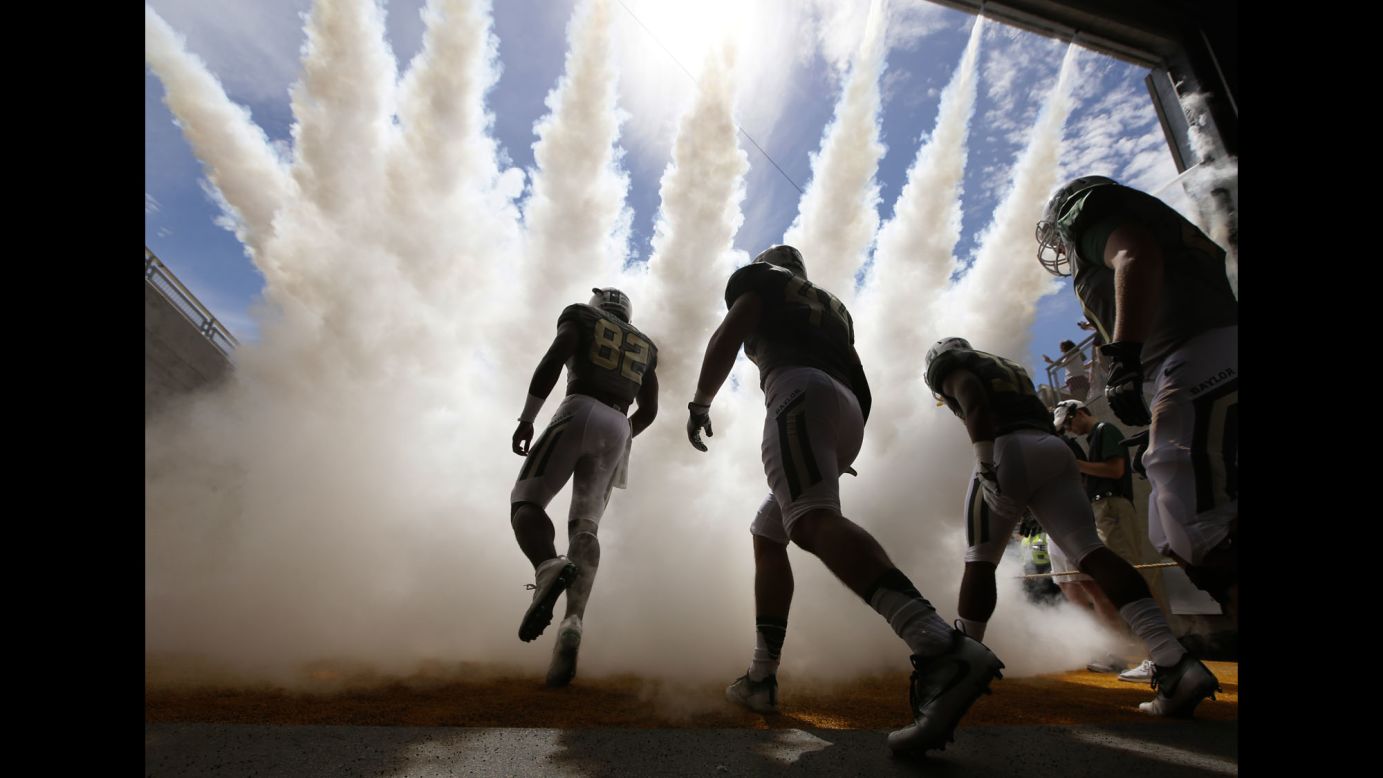 Baylor football players make their way onto the field for a game against Southern Methodist University in Waco, Texas, on Saturday, September 10. 