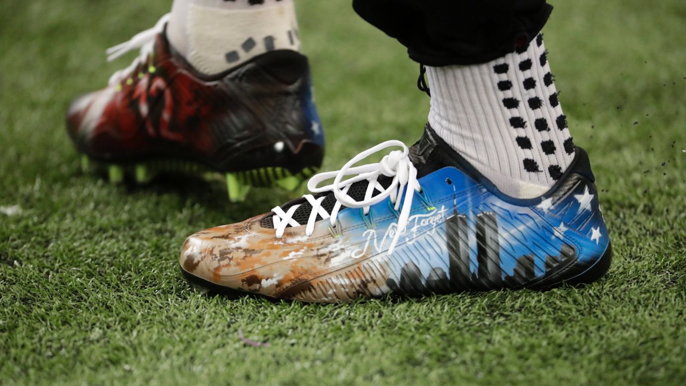 Atlanta's Julio Jones wears cleats in remembrance of the <a href="http://www.cnn.com/2016/09/08/us/new-york-9-11-magnum-photographers/index.html" target="_blank">9/11 attacks</a> before the first half of an NFL game against Tampa Bay in Atlanta on Sunday, September 11.