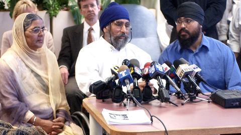 In 2003, Avtar Singh, center, was shot in his 18-wheeler while waiting for his son to pick him up in Phoenix. The shooter yelled: "Go back to where you came from."