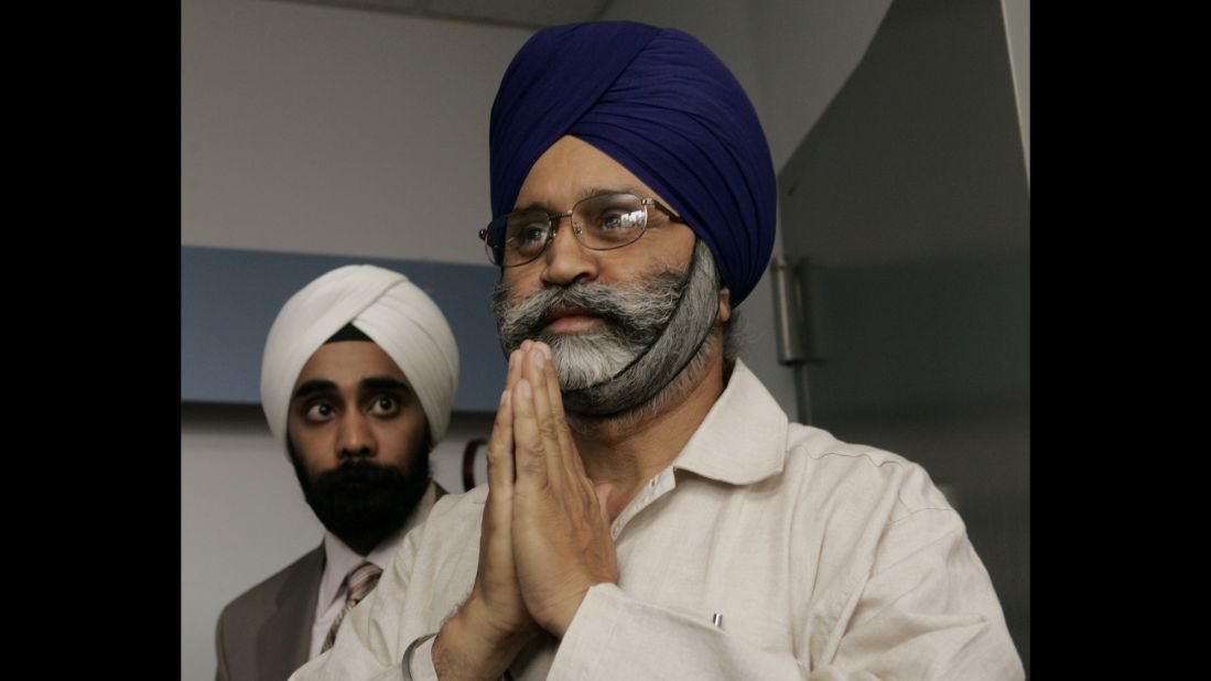 Cab driver Rajinder Singh Khalsa, right, was beaten unconscious   in Richmond Hill, New York, by attackers who mocked his turban and yelled: "Go back to your country." Five men were convicted in the incident.