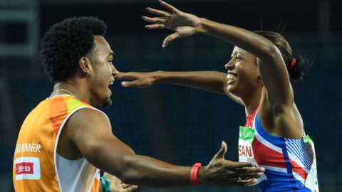 Cuba's Omara Durand celebrates with her guide, Yuniol Kindelan, after winning the women's T12 100-meter.