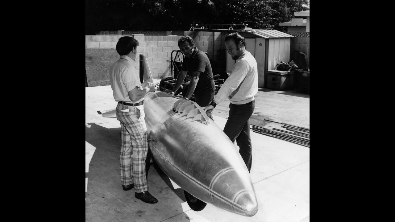 Knievel, center, and his team with their first test rocket. Knievel hired engineers Doug Malewicki and Robert Truax to build the craft and its steam engine.