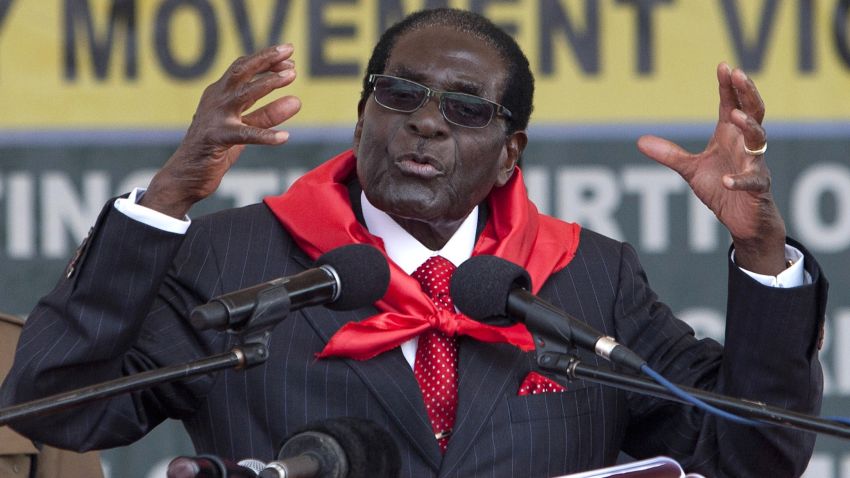 Zimbabwean President Robert Mugabe delivers a speech on February 28, 2015 during the celebration of his 91st birthday in Victoria Falls. Mugabe celebrated his 91st birthday with a lavish million dollar bash that was slammed by the opposition as "obscene" in a country wracked by poverty.The extravagance of Mugabe's birthday parties are a subject of annual controversy in Zimbabwe. AFP PHOTO / JEKESAI NJIKIZANA        (Photo credit should read JEKESAI NJIKIZANA/AFP/Getty Images)