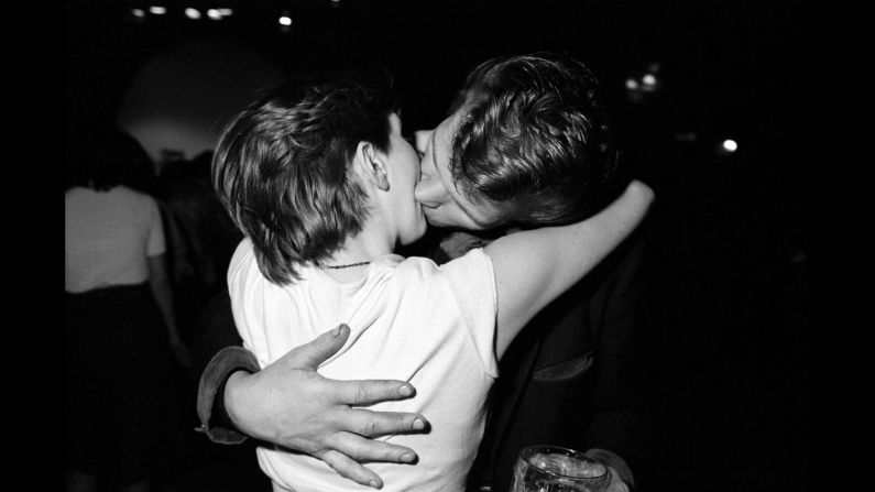 A couple kisses. Like stills from a movie, the characters in Steele-Perkins' photographs are out for a good time.