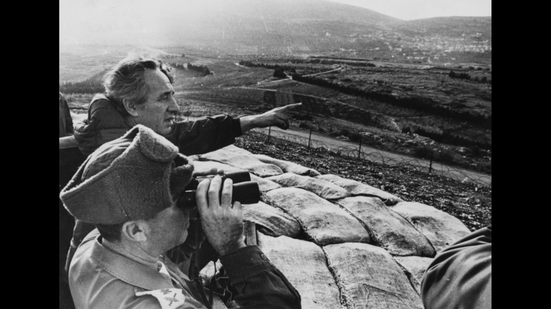 Shimon Peres, then defense minister, points over the northern Israel border toward Lebanon in 1976.