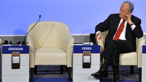 Israeli President Shimon Peres beside the empty seat of Turkish Prime Minister Recep Tayyip Erdogan after Erdogan stormed out of a debate with Peres about the three-week Gaza War at the World Economic Forum in Davos, Switzerland, on January 29, 2009.   