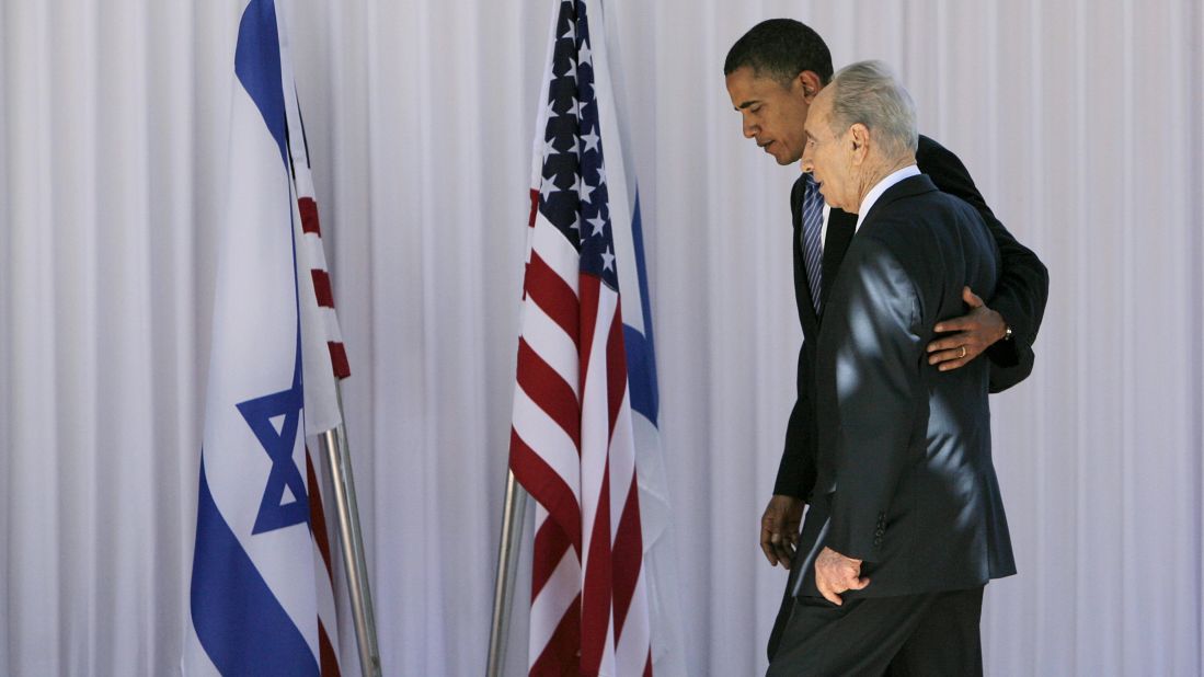Democratic presidential candidate Barack Obama, then a US Senator from Illinois, walks with Israeli President Shimon Peres in Jerusalem on July 23, 2008. 