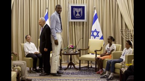 NBA star Amare Stoudemire stands with Israeli President Shimon Peres during their meeting at the president's residence in Jerusalem on July 18, 2013. Peres invited Stoudemire to play for Israel's national basketball team because of his ties to Judaism. 