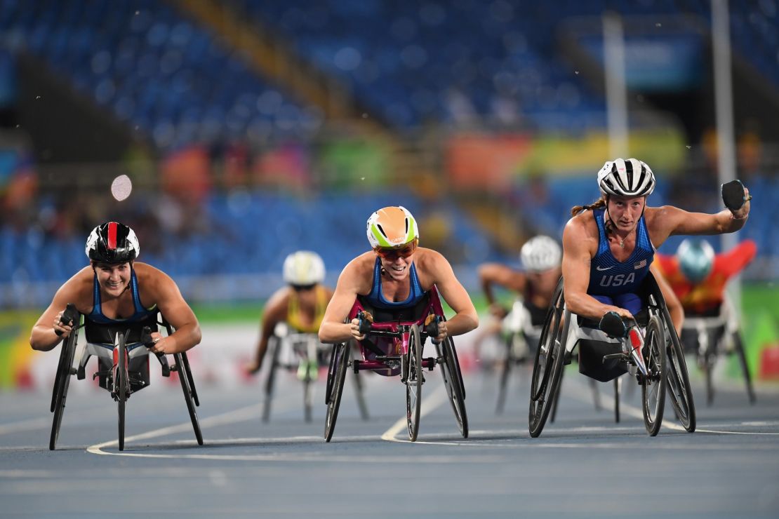 Left to right: Chelsea McClammer, Amanda McGrory and Tatyana McFadden celebrate winning silver, bronze and gold respectively in the T54 1500m.