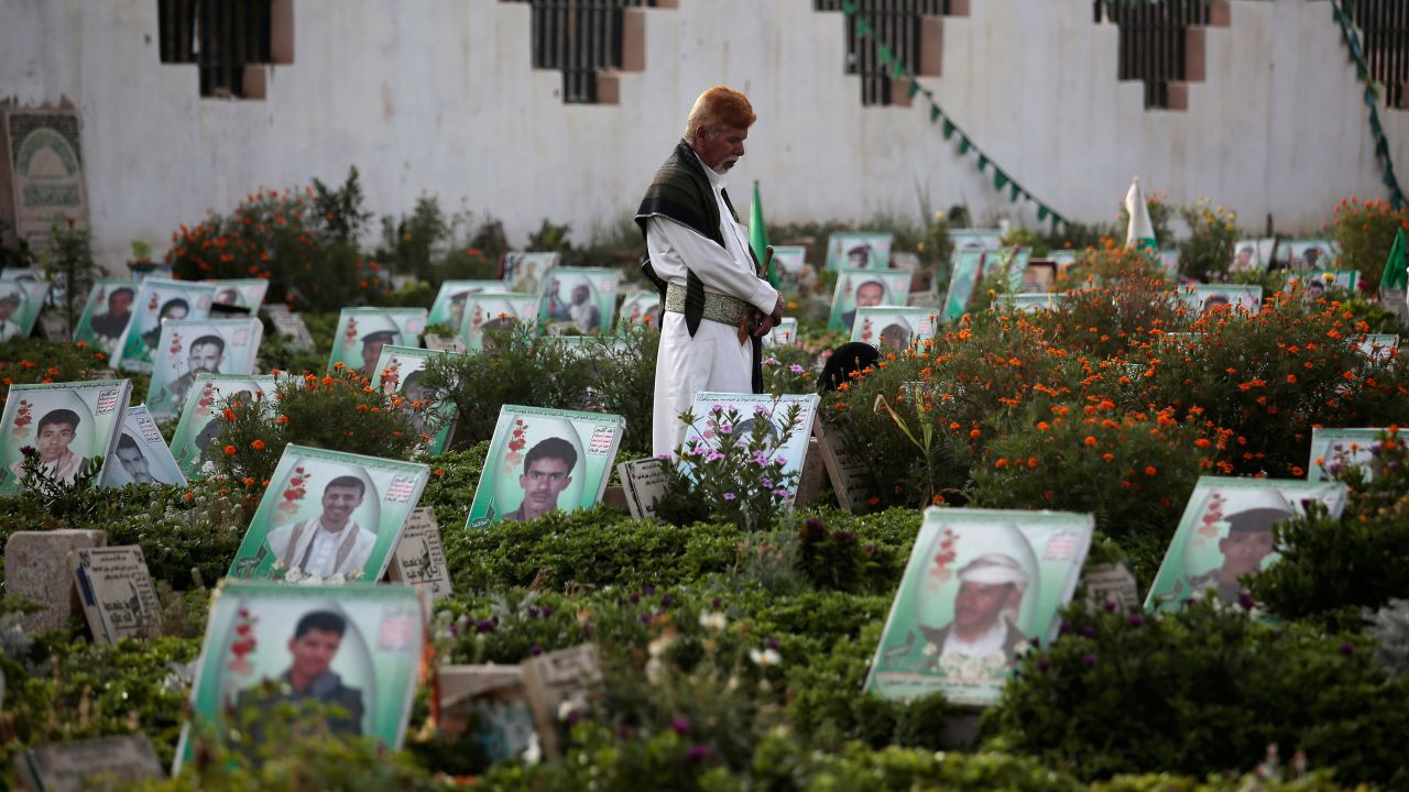 A man in Sanaa visits the grave of a relative killed in the conflict.