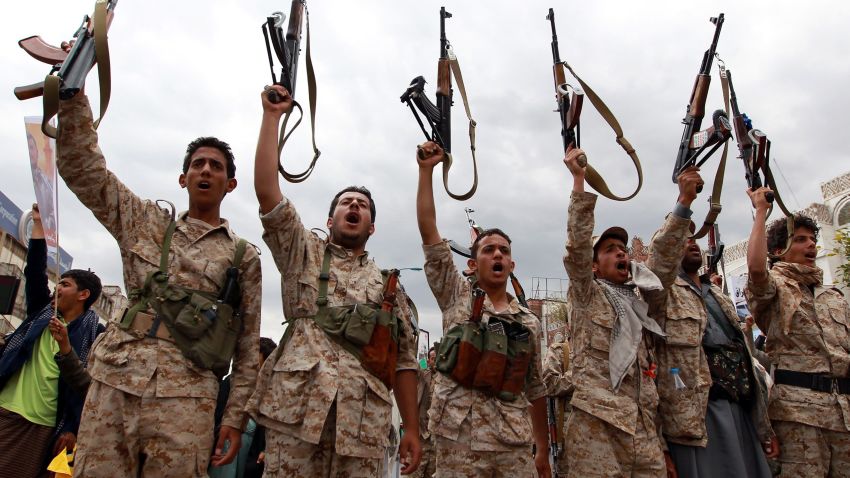 Men loyal to the Huthi movement brandish their weapons in March 2015 during a gathering in Sanaa to show support the Shiite Huthi militia and against the Saudi-led intervention in the country.