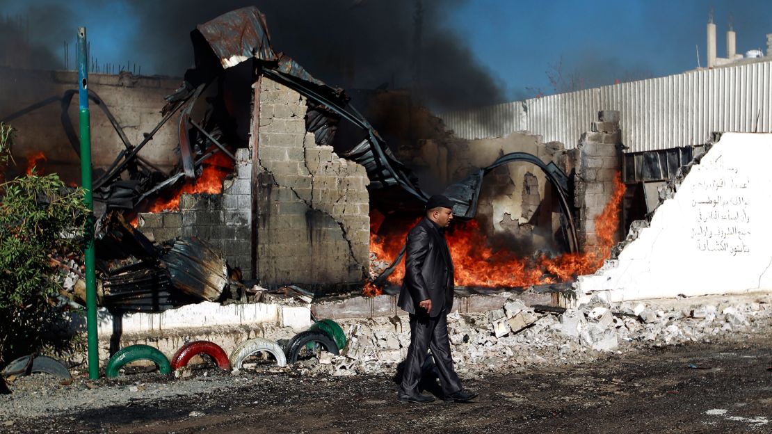 A building in flames after an airstrike by the Saudi-led coalition in February, in Sanaa.