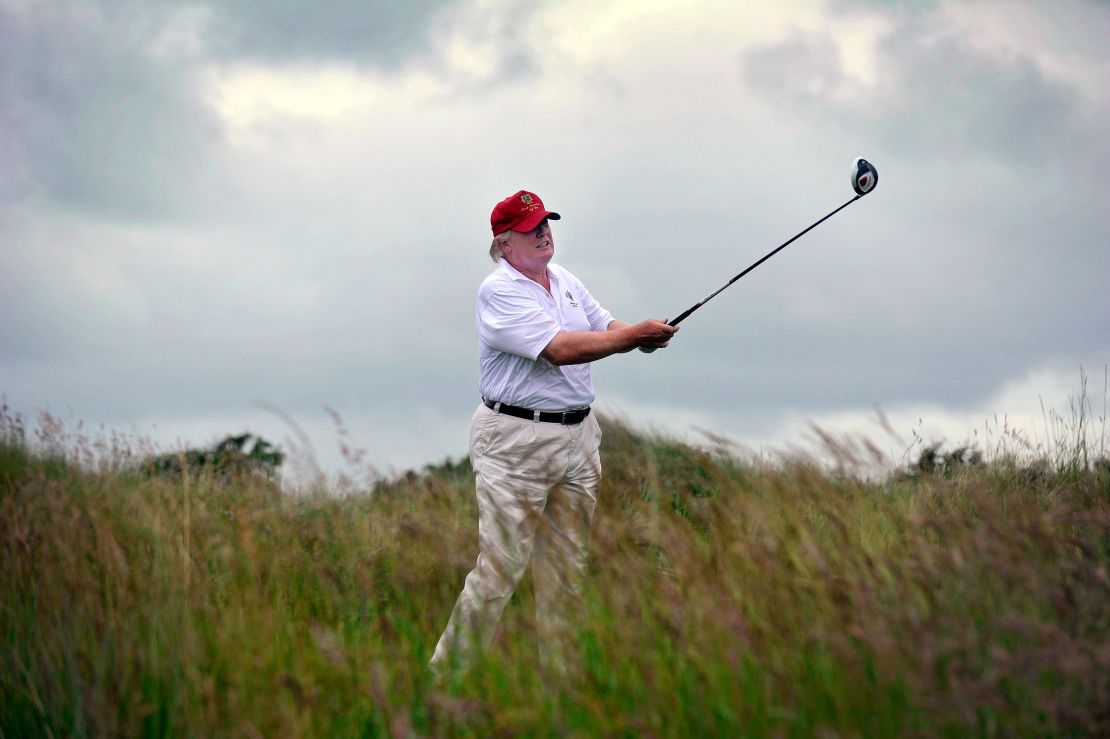 Donald Trump plays a stroke as he officially opens his new multi-million pound Trump International Golf Links course in Aberdeenshire, Scotland.