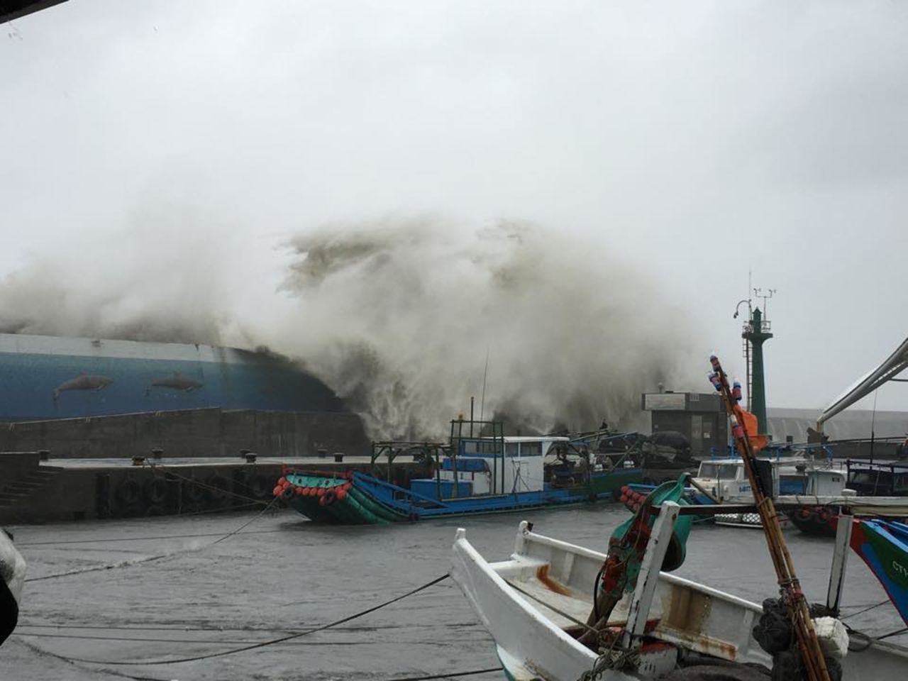 Huge waves wash over a ship in a fishing port in Taitung county, Taiwan. 