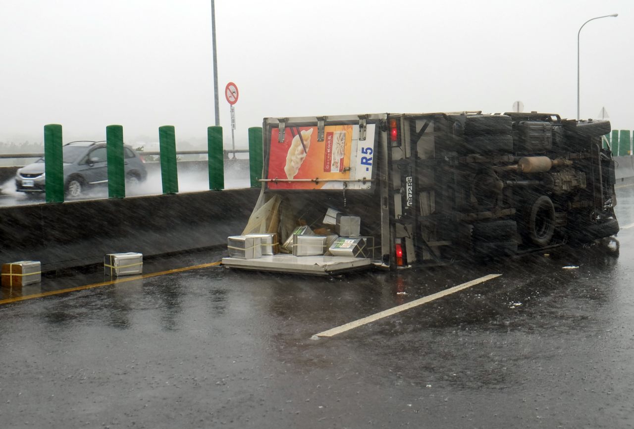 A truck is overturned in southern Pingtung county, Taiwan on September 14, 2016. The island is bracing for the impact of Super Typhoon Meranti. 