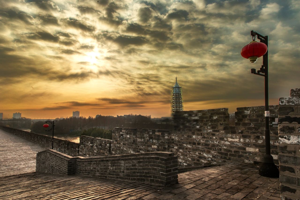 The reconstructed pagoda stands near the City Wall's Gate of China.