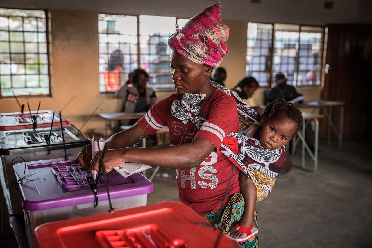 The results were contested by the opposition who<a href="http://www.reuters.com/article/us-zambia-election-idUSKCN10U1PK" target="_blank" target="_blank"> filed a petition</a> in the country's constitutional court claiming the vote was rigged. Pictured here, a woman casts her vote in the capital, Lusaka, on August 11. 