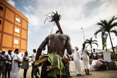 The unrest resulted in deadly violence, arrests and media black outs. Here,<br />a man traditionally dressed with banana leaves joins mourners paying their respects at an altar for those who died. <br />