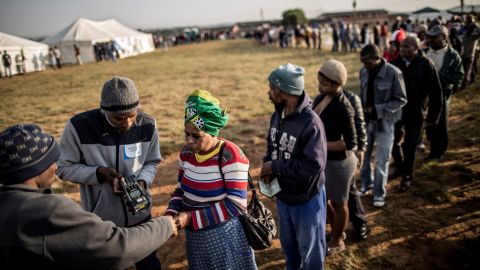 South African voters having their ID checked digitally at a polling station