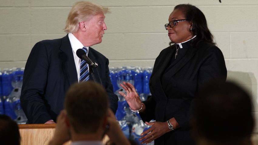 Rev. Faith Green Timmons interrupts Republican presidential candidate Donald Trump as he spoke during a visit to Bethel United Methodist Church, Wednesday, Sept. 14, 2016, in Flint, Mich. Timmons asked that Trump not deliver a political speech, and keep his message to the people of Flint. (AP Photo/Evan Vucci)