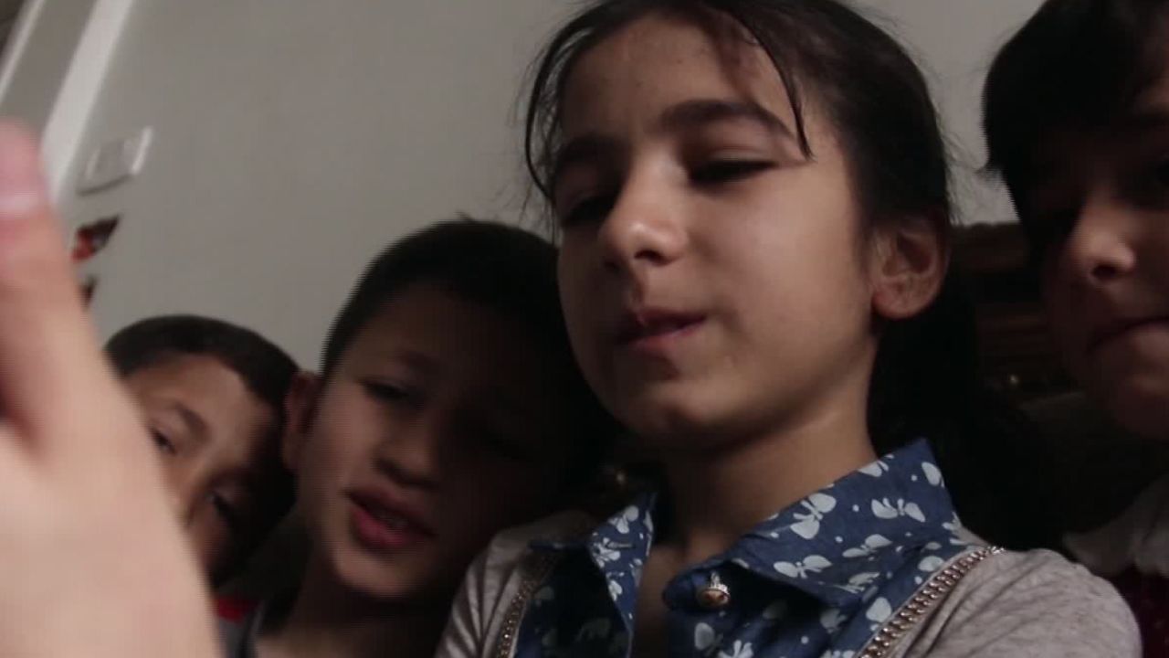 Doha and her brothers and sisters keep in touch with Yasmin through video calls.