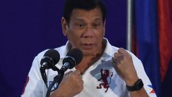 Philippine President Rodrigo Duterte gestures as he delivers speech before members of the Scout Rangers regiment at a military training camp in San Miguel town, Bulacan province, north of Manila on September 15, 2016. 
Rodrigo Duterte shot dead a justice department employee and ordered the murder of opponents, a former death squad member told parliament September 15, in explosive allegations against the Philippine president. / AFP / TED ALJIBE        (Photo credit should read TED ALJIBE/AFP/Getty Images)