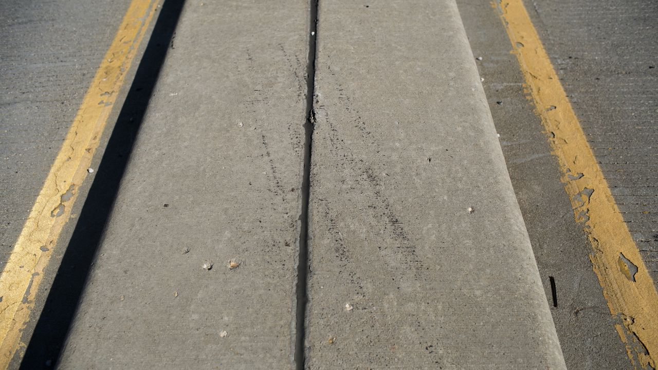 <strong>The highway: </strong>Police say the heroin epidemic in Huntington, West Virginia, has left virtually no place in town untouched. Here, tire marks remain on a concrete median where a car crashed near a bridge on August 15. The 21-year-old driver overdosed with her engine still running.
