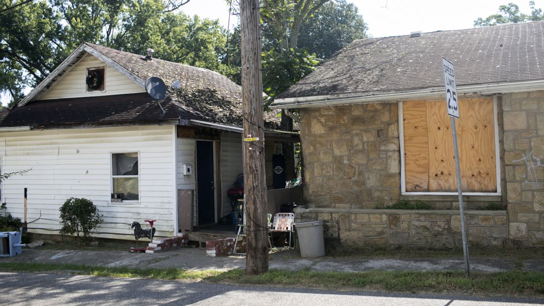 <strong>A home: </strong>Paramedics responded to the house on the left, where they said children's toys dotted the living room floor as they tended to a 28-year-old woman.