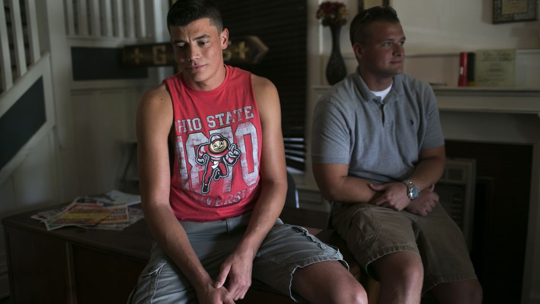 Jay Turley, 33, and Will Lockwood sit in one of The Lifehouse's recovery homes. The Lifehouse serves 60 men and 35 women in Huntington. Lockwood mentors men like Turley who desperately want to quit.