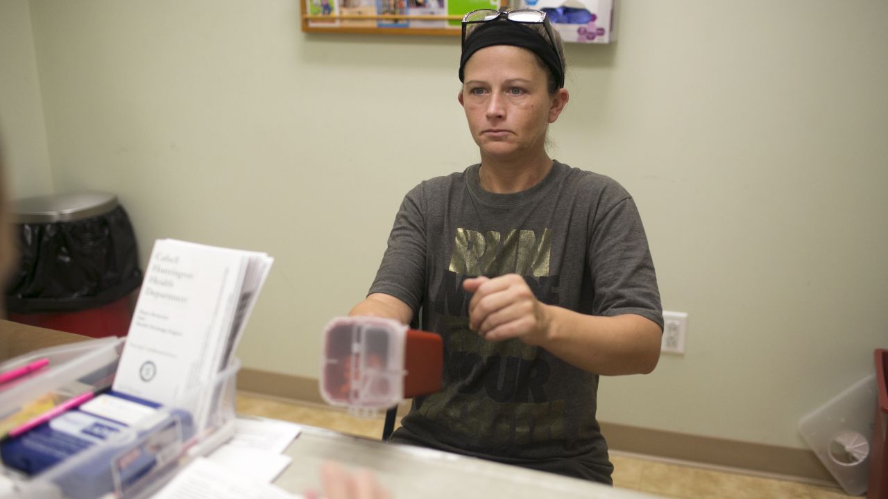 Andrea trades dirty needles for clean ones at the health department's exchange program.