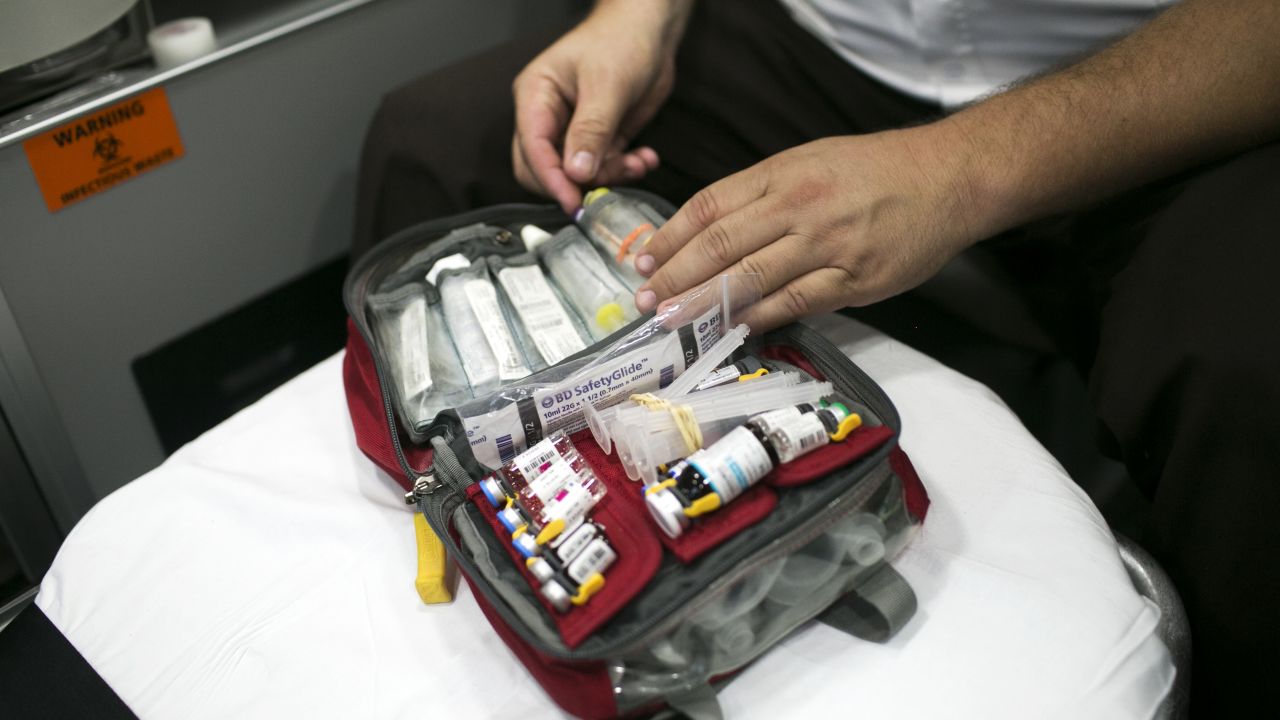 Capt. Derrick Ray takes naloxone out of a first-responder's kit. Many residents carry the opiate blocker in case they encounter an overdose.