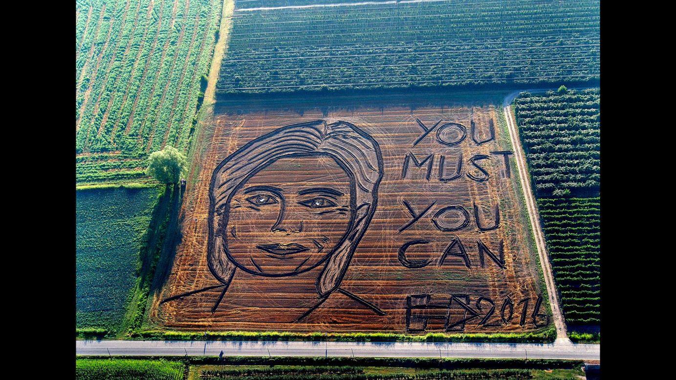 A giant portrait of US Democratic presidential nominee Hillary Clinton is plowed on a field in Castagneto, Italy, on Tuesday, September 13. 