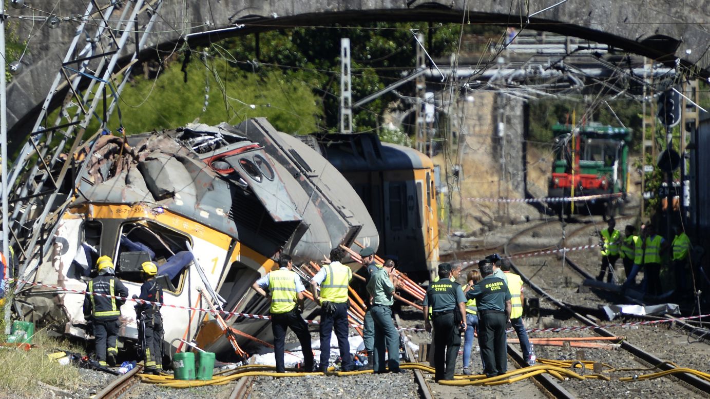 Spanish police officers, firefighters and security members inspect the wreckage of a <a href="http://www.cnn.com/2016/09/09/europe/spain-train-crash-vigo/" target="_blank">train that derailed</a> in O Porrino, Spain, on Friday, September 9. At least four people were killed and nearly 50 were injured.