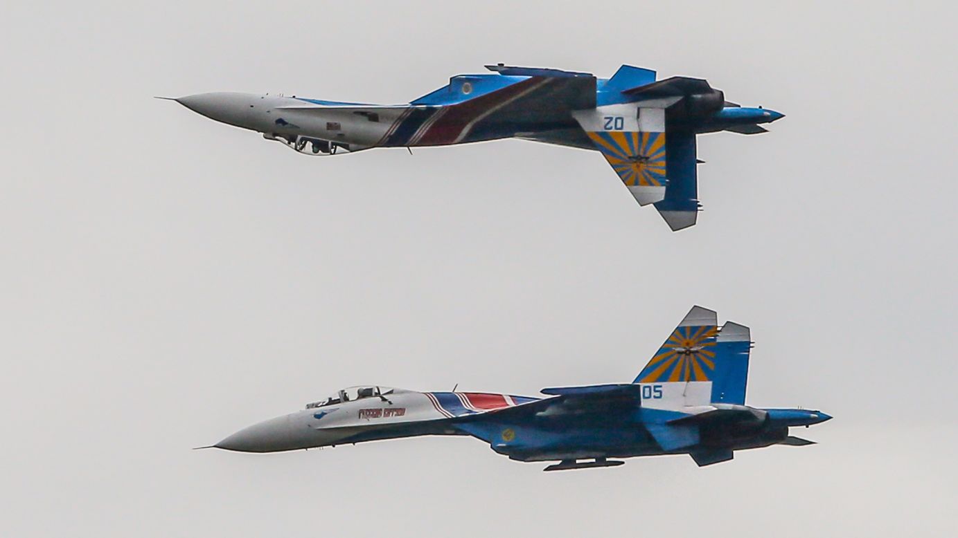 The Russian Knights -- a Russian Air Force  aerobatic demonstration team -- fly Sukhoi Su-27 fighter aircrafts during the "International Military-Technical Forum" -- an exhibition of weapons and military equipment -- in Kubinka, Russia, on Friday, September 9.