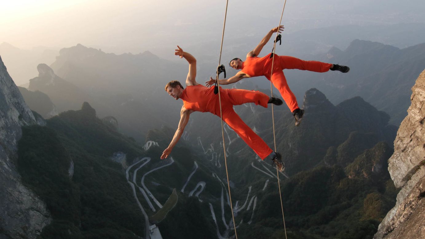 A dance group performs on cliffs in Zhangjiajie, China, on Sunday, September 11.