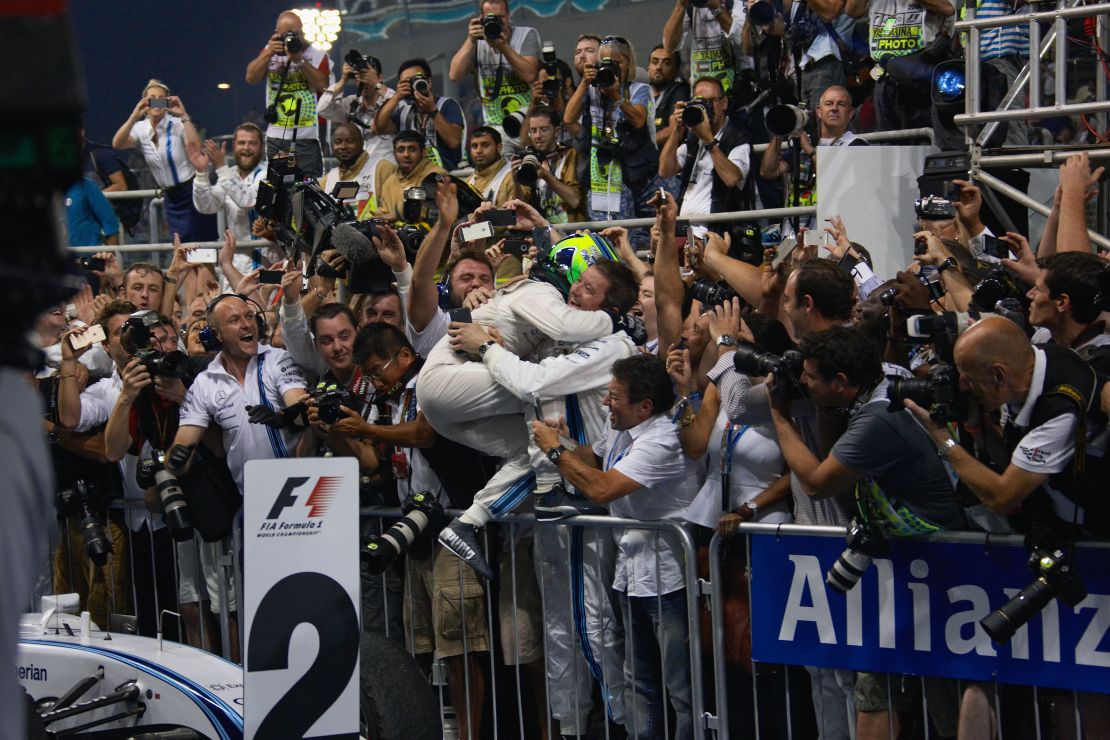 Massa celebrates his sole runner-up finish at Williams with the team's technical staff.
